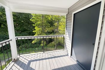 the view from the balcony of a home with a large screen door and a yard at Deercross Apartments, Cincinnati, OH 45236